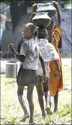 Girls carry drinking water