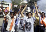 Supporters of the ruling Hindu nationalist Bharatiya Janata Party (BJP) celebrate election victory on the street in Ahmedabad, December 15, 2002. The BJP won elections in Gujarat state after campaigning on a hardline Hindu platform which critics said preyed on fear of the Muslim minority. REUTERS/Amit Dave