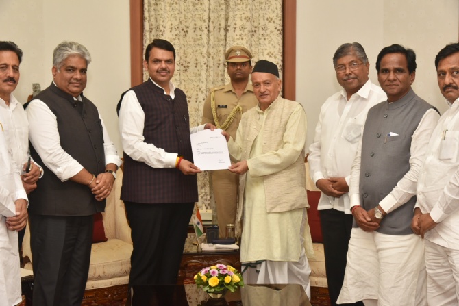 Devendra Fadnavis, accompanied by senior Bharatiya Janata Party leaders, submits his resignation as Maharashtra chief minister to Governor Bhagat Singh Koshyari. Photograph: Arun Patil  