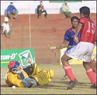 Gurmeet Singh (red jersey) is poised to slam home the equaliser for Punjab Police