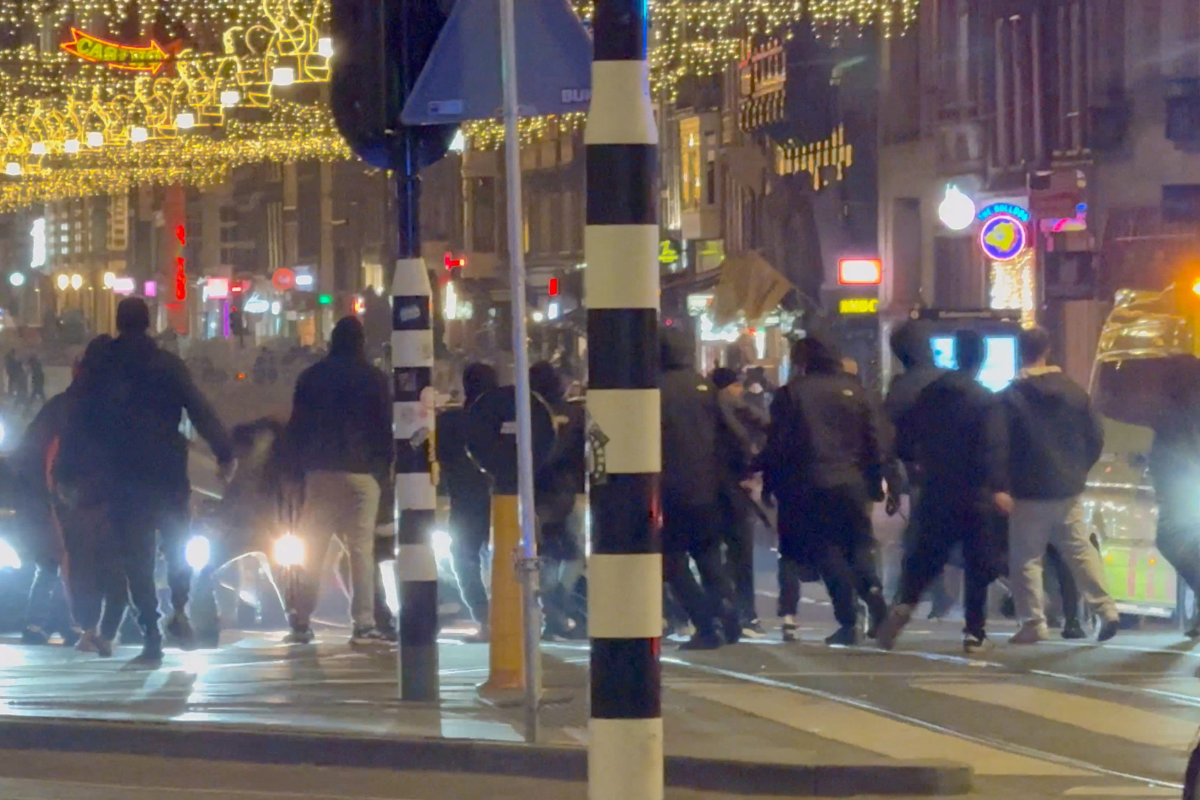 Israeli football supporters and Dutch youth clash near Amsterdam Central station, in Amsterdam, Netherlands, on Friday