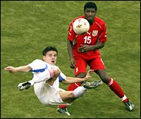 Russia's Ruslan Pimenov makes a scissor kick in front of Tunisias Radhi Jaidi 